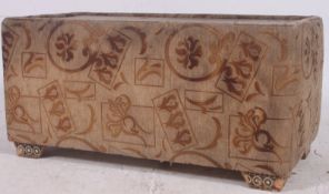 A 1950's retro upholstered coffee table having inlaid tunbridge ware detailed top all on castors