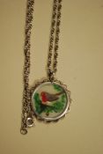 A 925 silver white metal ladies necklace with hand painted robin to centre.  Weight 9.1 grams