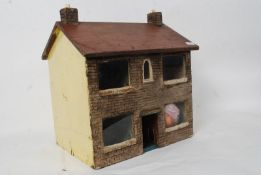 A vintage 20th century dolls having with pitched roof and decorative facia