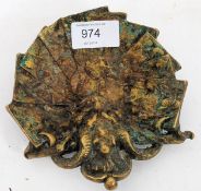 An unusual bronze dish of a grotesque mask with detailed centre. Raised over tripod feet