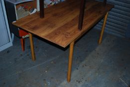 A walnut veneer 1930's Dinette retro dining table raised on turned column legs having fitted