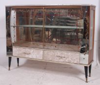 A good mid 20th century glazed decorative 1950's display /cocktail cabinet with mirror back having
