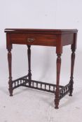 A late 19th century solid Mahogany inlaid games table having backgammon, Chess board flip and swivel