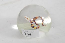 A 20th century glass paperweight in the manner of Paul Ysart having inset snake to centre