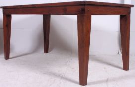 A large 20th century refectory dining table, made of hardwood raised on squared tapered legs with