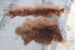 2 vintage retro mid 20th century fur floor rugs, one long, one circular made of sheep skin
