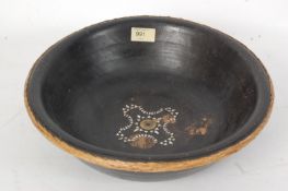 A 19th century carved wood ebonised Chinese oriental bowl, with intricate straw work rim and brass
