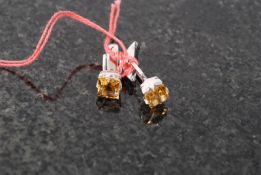 A pair of white metal 925 silver and citrine set cufflinks.  Weight 5.8 grams