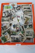 A collection of cigarette cards to  include various subjects animals, tribal, landscapes towns etc