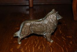 A solid cast bronze figure of a Rough Collie