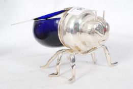 A 20th century glass silver plated honey pot in the shape of a bee.  Weight 415 grams