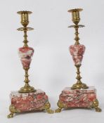 Two Victorian marble and brass candlesticks garnitures.