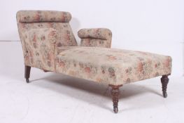 A Victorian chaise longue in the manner of Howard & Son, London. Raised on mahogany turned legs with