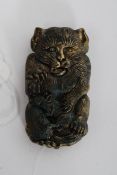 A brass Chinese oriental vesta case in the form of a cat