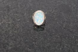 A white metal 925 silver and opalite set ring.  Weight 3 grams. N