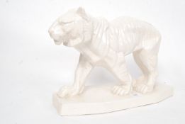 A large Victorian style ceramic lion on a stand