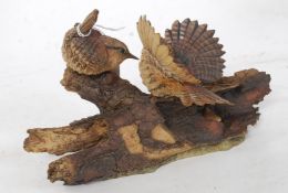 An Arden Sculptures ' The Collections ' titled Wrens on Log By Christopher Holt