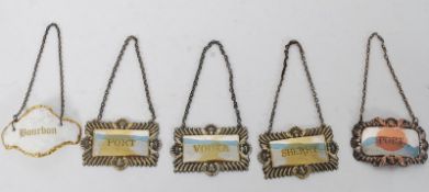 A collection of five  silver plated decanter labels to include Port, Whisky, Vodka and Sherry