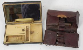 2 early 20th century leather cased vanity sets