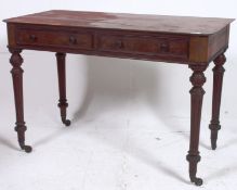 A 19th century Regency mahogany writing table desk. Raised on turned tapered legs with castors