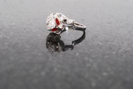 A 20th century white metal 925 silver ladies jewellery ring in the form of a panther with red