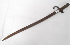 A 19th century French chassepot double edge bayonet with brass handle having notation to the top