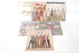A quantity of vintage vinyl record LP's to include 4x Bay City Rollers, The Osmonds and The
