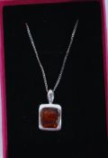 A Baltic amber pendant silver necklace