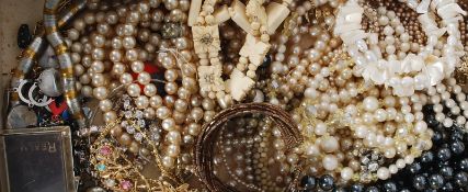 A collection of costume jewellery to include brooches, necklaces, bangles etc please see images