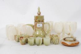 A 20th century middle eastern coffee set in onyx to include pot, 10x cups along with 6x onyx