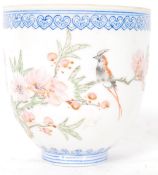 An early 20th century Chinese oriental fine porcelain cup, painted with traditional oriental