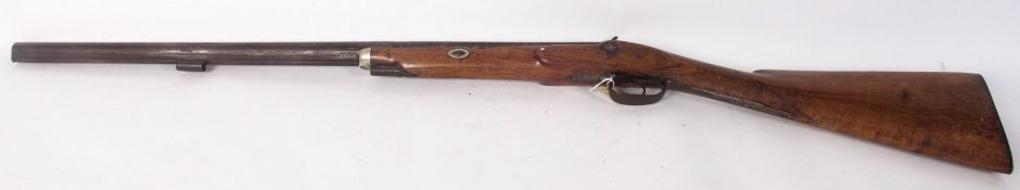 A 19th century British 20 bore percussion cap rifle. The 68cms steel barrel with British proof marks