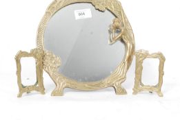 A vintage brass barbola mirror together with 2 Art Nouveau miniature brass photo frames