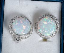 A pair of silver and CZ opalite earrings