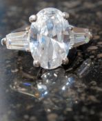 A silver and large CZ dress ring stamped