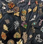 A selection of brooches some with semi p