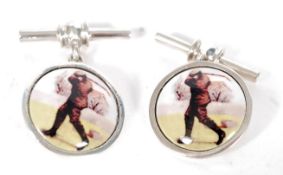 A pair of silver and enamel cufflinks de