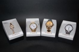 A collection of 4 Timex watches being ne