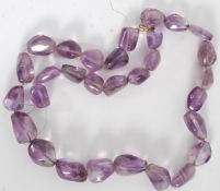 An amethyst necklace lacking clasp