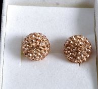 A pair of silver earings set with CZ bal