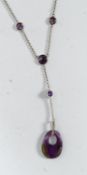 A silver and amethyst pendant necklace