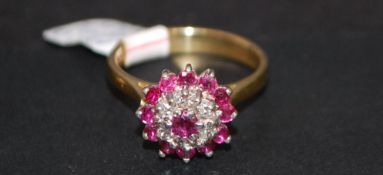 18ct gold ruby and diamond cluster ring.