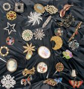 A selection of brooches some with semi p