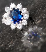 A silver ring set with synthetic saphire