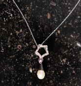 A silver CZ and pearl drop necklace