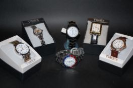 A collection of Timex watches being new