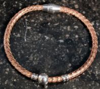 A silver gilt bangle with magnetic clasp