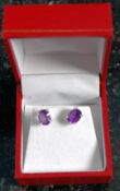 A pair of silver and amethyst earrings