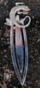 A silver bookmark with a lizard mount st