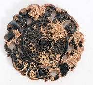 A hardstone carved Chinese disk